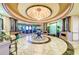 Community clubhouse lobby featuring tile floors, pillars, a chandelier and decorative accents at 8304 Grand Estuary Trl # 104, Bradenton, FL 34212