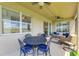 Covered patio boasts an outdoor seating area, ideal for relaxation and enjoying fresh air at 8304 Grand Estuary Trl # 104, Bradenton, FL 34212