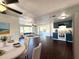 Open floor plan with a dining table in the foreground, seamlessly transitioning into the living room and kitchen at 9430 Glen Moor Ln, Port Richey, FL 34668
