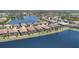 Aerial view of homes alongside a lake and green spaces at 7036 Highgate Ln, Lakewood Ranch, FL 34202