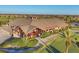 Aerial view of community clubhouse with verdant landscaping and golf course showcases a picturesque and inviting setting at 7036 Highgate Ln, Lakewood Ranch, FL 34202