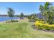 Well maintained backyard landscape, lake, and neighborhood in the distance at 7036 Highgate Ln, Lakewood Ranch, FL 34202