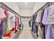 Spacious walk-in closet with extensive hanging space for organized wardrobe storage at 7036 Highgate Ln, Lakewood Ranch, FL 34202
