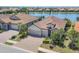 Beautiful single Gathering home with a three-car garage overlooking a lake at 7036 Highgate Ln, Lakewood Ranch, FL 34202