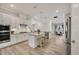 Modern kitchen with granite countertops, stainless steel appliances, and a central island with barstool seating at 7036 Highgate Ln, Lakewood Ranch, FL 34202