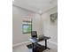 Home office space with a desk and view of a lovely landscaped yard at 7036 Highgate Ln, Lakewood Ranch, FL 34202