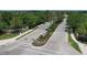 Well-manicured landscaping and a community sign line this street view at 7036 Highgate Ln, Lakewood Ranch, FL 34202