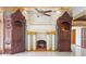 Elegant fireplace featuring a decorative mantel, pillars, and built-in shelves at 1577 Alexander Rd, Belleair, FL 33756