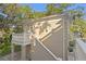 Exterior view of a separate garage structure, showcasing its design and integration at 1577 Alexander Rd, Belleair, FL 33756