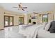 Luxurious main bedroom boasting a fireplace, double doors to a balcony, and ample natural light at 1577 Alexander Rd, Belleair, FL 33756