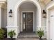 Inviting front entrance featuring a decorative door with sidelight windows and classic outdoor lighting at 17114 Verona Pl, Lakewood Ranch, FL 34202