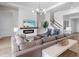 Cozy living room showcasing a fireplace, TV, stylish decor, and comfortable seating arrangement at 17114 Verona Pl, Lakewood Ranch, FL 34202