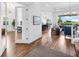 Open-concept living area with wood floors, recessed lighting, and seamless flow to the outdoors at 17114 Verona Pl, Lakewood Ranch, FL 34202