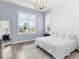 Light-filled main bedroom with a serene ambiance, a large window, and comfortable furnishings at 17114 Verona Pl, Lakewood Ranch, FL 34202