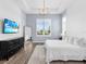 Spacious main bedroom featuring abundant natural light, tray ceiling, and a calming color palette at 17114 Verona Pl, Lakewood Ranch, FL 34202
