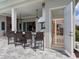 Outdoor bar with seating, stainless grill and open door to house sauna at 17114 Verona Pl, Lakewood Ranch, FL 34202