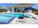 Inviting backyard pool and spa area with outdoor seating and poolside loungers, ideal for relaxation at 17114 Verona Pl, Lakewood Ranch, FL 34202
