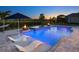 Inviting pool with water features, fire bowls, chaise lounges and lush tropical landscaping at 17114 Verona Pl, Lakewood Ranch, FL 34202