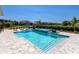 Stunning pool and spa combo with sun loungers and lush landscaping, perfect for outdoor relaxation at 17114 Verona Pl, Lakewood Ranch, FL 34202