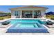 Luxury pool with integrated spa featuring elegant blue tiling, perfect for relaxation and backyard entertainment at 17114 Verona Pl, Lakewood Ranch, FL 34202