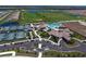 Aerial view of the community with clubhouse, pool, tennis courts, and golf course at 17118 Vardon Ter # 307, Bradenton, FL 34211