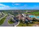 Aerial view of community with a pool, golf course, tennis courts, clubhouse and scenic ponds at 17118 Vardon Ter # 307, Bradenton, FL 34211