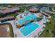 Resort-style pool area with waterfalls, sun loungers, and lush landscaping, creating a relaxing oasis at 17118 Vardon Ter # 307, Bradenton, FL 34211