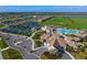 Aerial view of a planned community with a clubhouse, pool, tennis courts, and golf course at 17118 Vardon Ter # 307, Bradenton, FL 34211