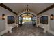 Inviting entryway featuring an arched gate, benches and stylish lighting creating an elegant welcome at 17118 Vardon Ter # 307, Bradenton, FL 34211