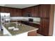 Modern kitchen features stainless steel appliances, granite countertops, a kitchen island and plenty of cabinet storage at 17118 Vardon Ter # 307, Bradenton, FL 34211