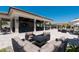Outdoor lounge area with comfortable seating, a fire pit, and a bar at 17118 Vardon Ter # 307, Bradenton, FL 34211