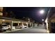 View of the covered parking area at night, providing ample parking spaces at 17118 Vardon Ter # 307, Bradenton, FL 34211