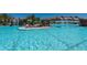 Spacious swimming pool area featuring a stunning rock waterfall at 17118 Vardon Ter # 307, Bradenton, FL 34211