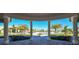 Stunning view of the community pool area, showcasing tropical landscaping and a relaxing atmosphere at 17118 Vardon Ter # 307, Bradenton, FL 34211