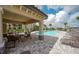 Community pool pavilion offering shade and seating, with views of the sparkling pool and lush landscaping at 17118 Vardon Ter # 307, Bradenton, FL 34211