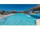 Large swimming pool with waterfall and an inviting clubhouse at 17118 Vardon Ter # 307, Bradenton, FL 34211