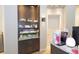 Spa interior shot featuring product display shelves, a decorative stone wall, and light wood floors at 17118 Vardon Ter # 307, Bradenton, FL 34211