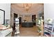 Well lit spa reception area with light wood floors, a barrel ceiling and display shelves full of products at 17118 Vardon Ter # 307, Bradenton, FL 34211