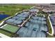 Aerial view of multiple tennis courts and green landscaping in a well-maintained community at 17118 Vardon Ter # 307, Bradenton, FL 34211