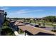 A view of the community and water features from a balcony, showing a lovely landscape at 17118 Vardon Ter # 307, Bradenton, FL 34211