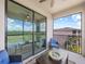 Enjoy the covered balcony with seating and a view overlooking the golf course at 17902 Gawthrop Dr # 401, Bradenton, FL 34211