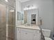 Modern bathroom with a glass shower, spacious vanity, and contemporary fixtures at 17902 Gawthrop Dr # 401, Bradenton, FL 34211