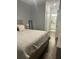 Bedroom with hardwood floors, ensuite bathroom, and a soothing color palette for a relaxing atmosphere at 17902 Gawthrop Dr # 401, Bradenton, FL 34211