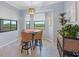 Charming dining area featuring a round table, wicker chairs, and windows that bring natural light at 17902 Gawthrop Dr # 401, Bradenton, FL 34211