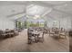 An elegant dining room with ample seating, neutral colors, and plenty of natural light at 17902 Gawthrop Dr # 401, Bradenton, FL 34211