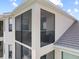 Exterior view of a building with large screened patios at 17902 Gawthrop Dr # 401, Bradenton, FL 34211