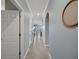 Inviting hallway featuring tile flooring, archway, and soothing blue walls at 17902 Gawthrop Dr # 401, Bradenton, FL 34211
