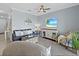 Comfortable living room with tile flooring, a ceiling fan, and stylish decor creating a cozy ambiance at 17902 Gawthrop Dr # 401, Bradenton, FL 34211