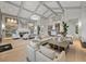 Bright lounge area featuring neutral furniture, wood floors, high ceilings and views to outdoors at 17902 Gawthrop Dr # 401, Bradenton, FL 34211