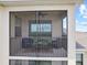 Inviting screened balcony with comfortable seating perfect for enjoying outdoor living at 17902 Gawthrop Dr # 401, Bradenton, FL 34211